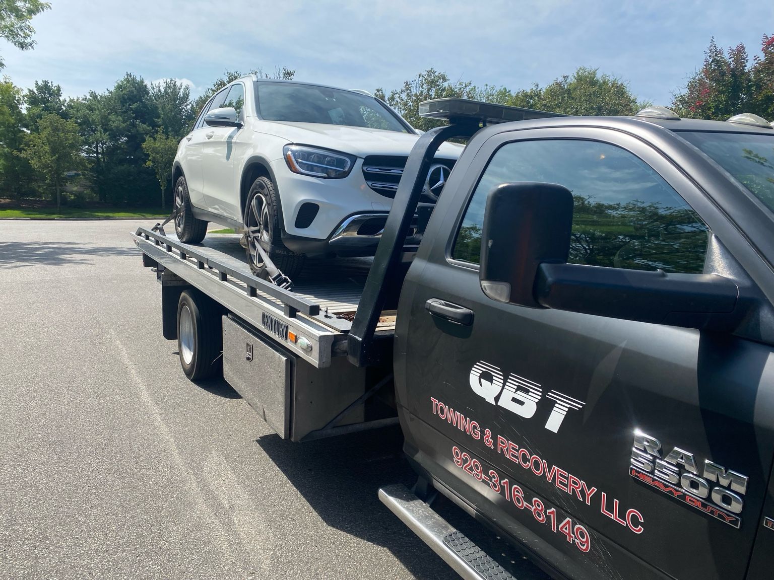 QBT truck staged on street for towing