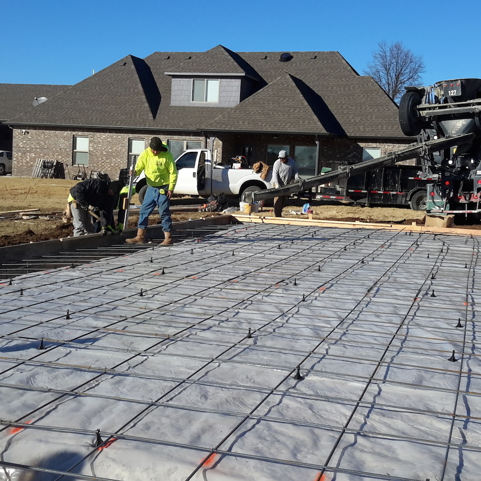 Engineered concrete systems tulsa oklahoma engineered footings and slabs during photo of new concrete slab installation with concrete footings finishing and checking the concrete footings 20171207 14383720180108 1236 hpy8a5