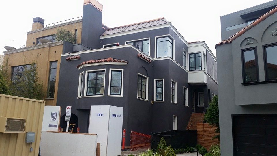 Miguel's Painting crew working on a North Bay home
