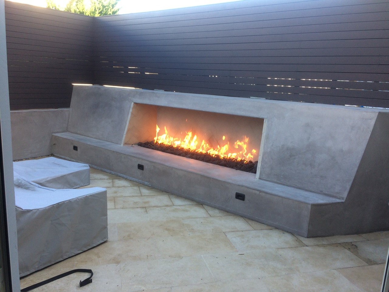 Outdoor living area with seating and fire feature