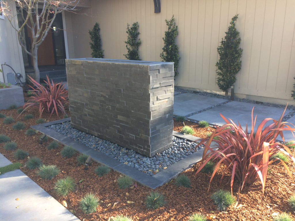 Stone hardscape with paths and retaining elements