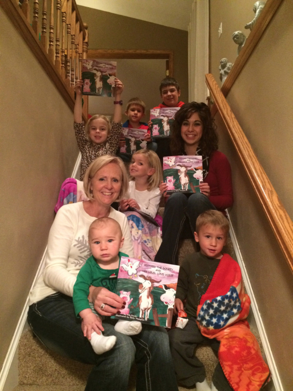Kim and her 7 grandchildren! They love Richard the Donkey! 26f23a64836846c8856ace91010780d1