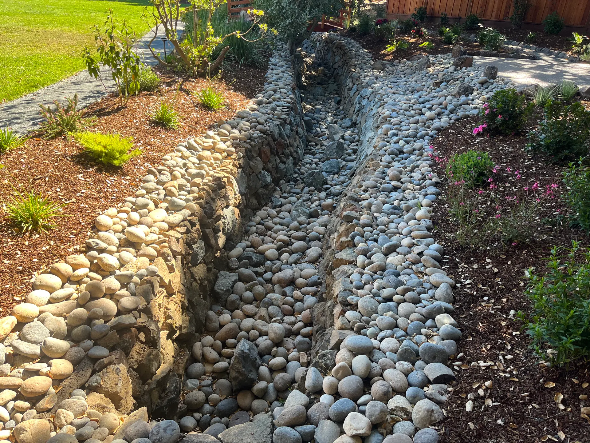 Stonework and drainage rock installation by Garcia's Landscaping