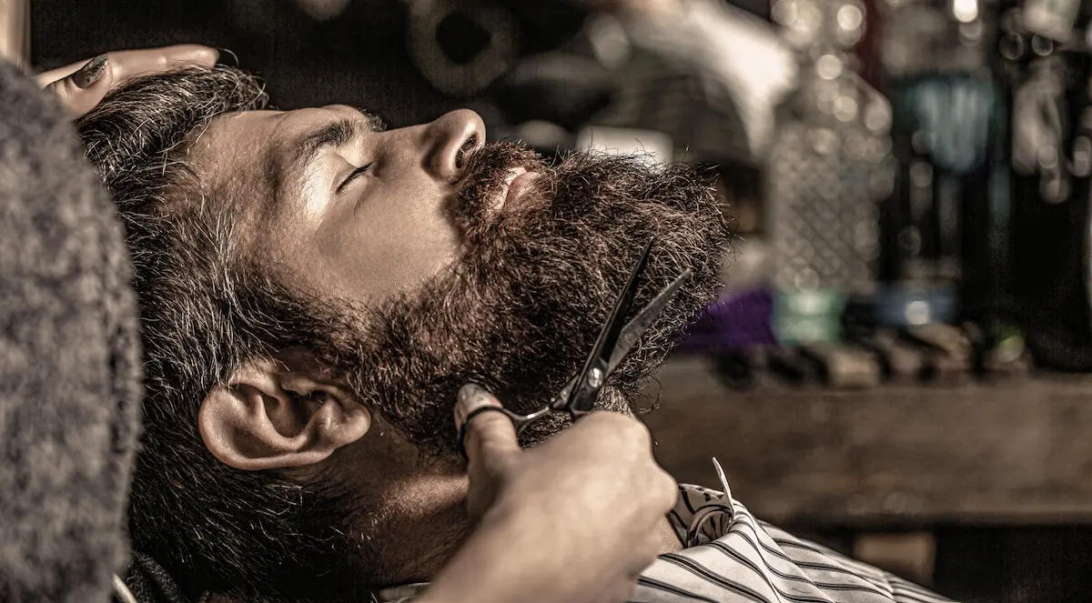 Barber scissors and tools in a vintage barbershop representing professional men's grooming and hairstyling services