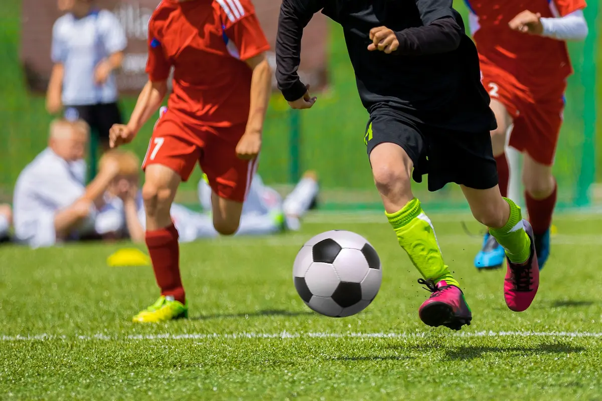 Young players competing in a youth soccer tournament representing the competitive development environment and team culture of a dedicated soccer club program