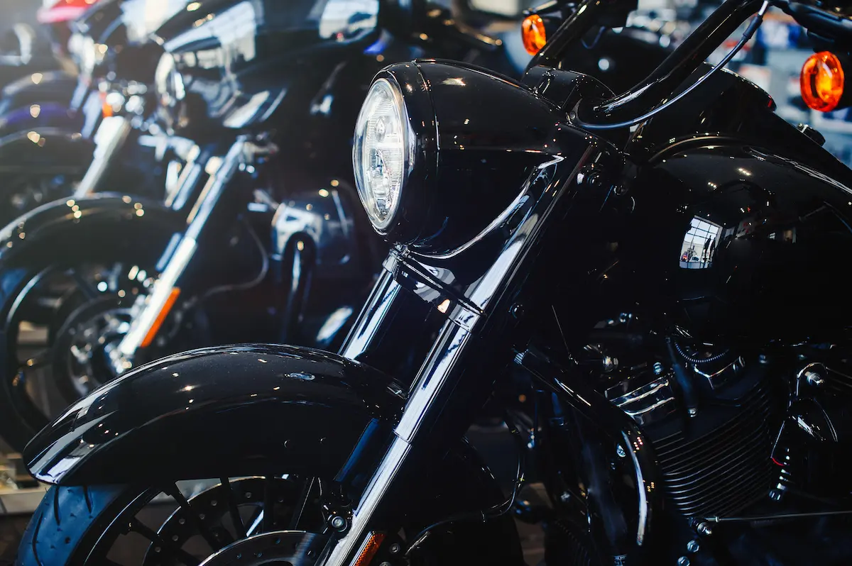 Modern motorcycle store showroom displaying new motorcycles and accessories representing the full-service retail, service, and parts experience that a professional motorcycle shop provides for riders