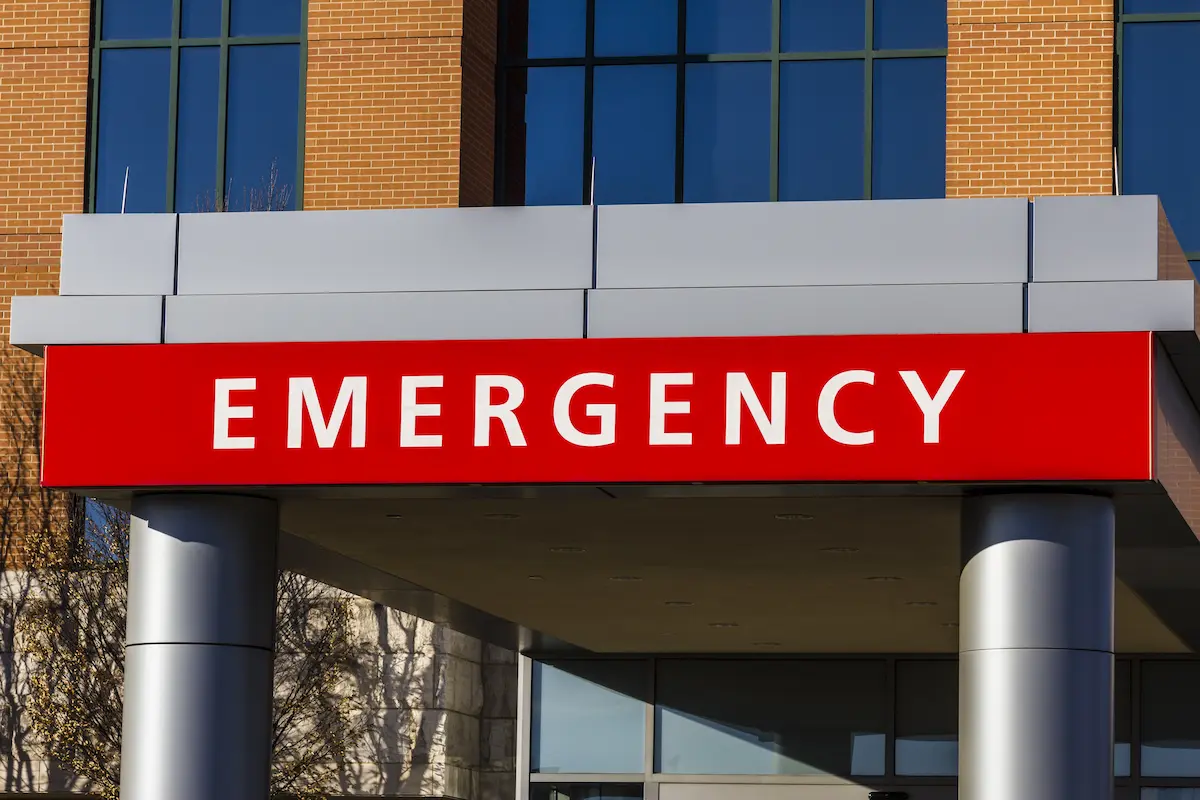 Red emergency entrance sign for a medical facility representing the immediate and professional urgent care and walk-in medical services that an urgent care center provides for patients seeking prompt treatment