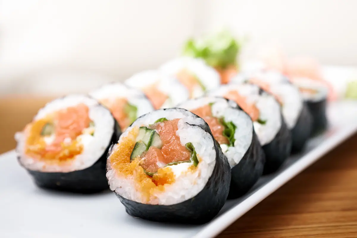 Beautiful salmon and caviar sushi rolls representing the fresh, skillfully prepared Japanese cuisine that a quality sushi restaurant delivers to its diners