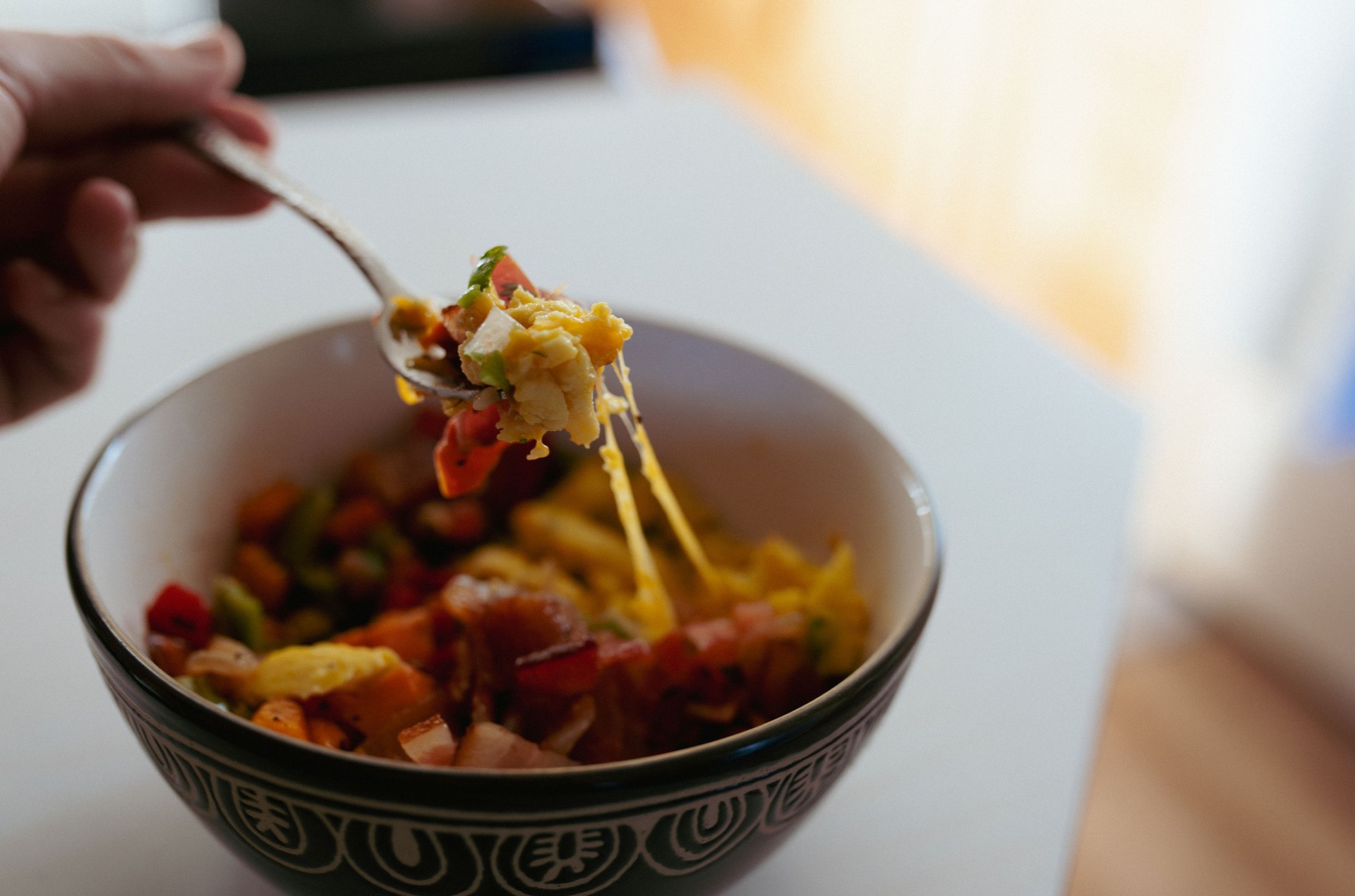 Last Bite breakfast bowl with scrambled eggs, bell peppers, potatoes and pico de gallo